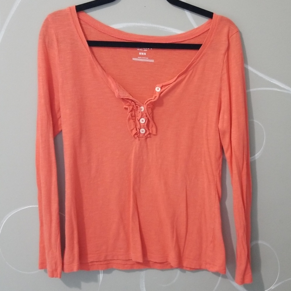 Orange long sleeved shirt